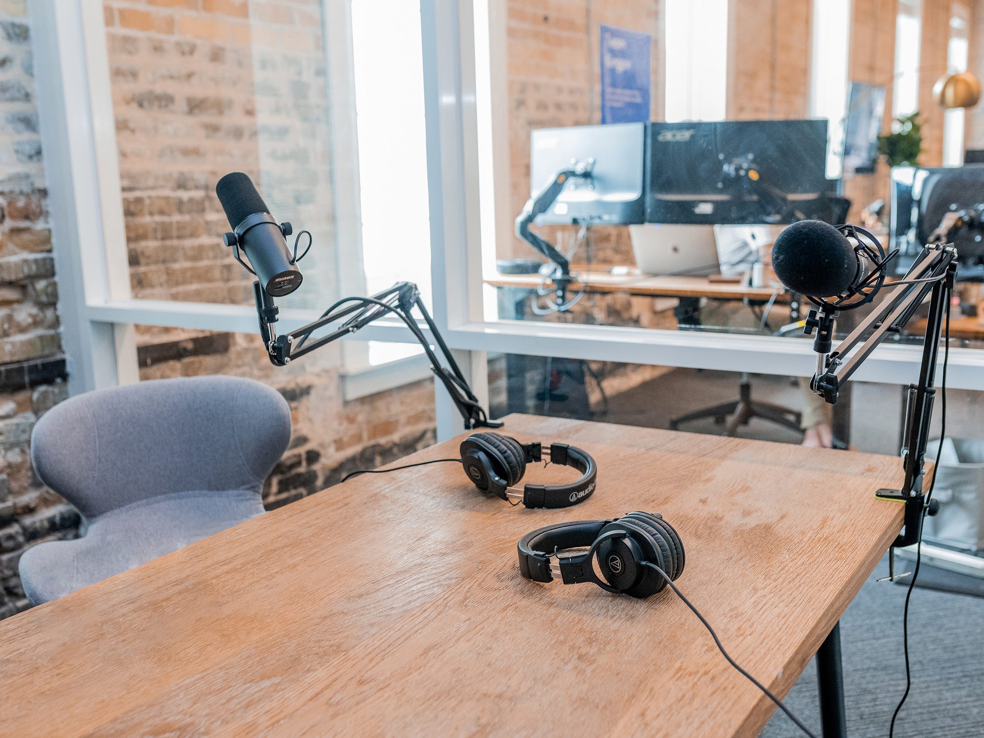 Budget podcast studio setup: Acoustic treatment with blankets & rug.